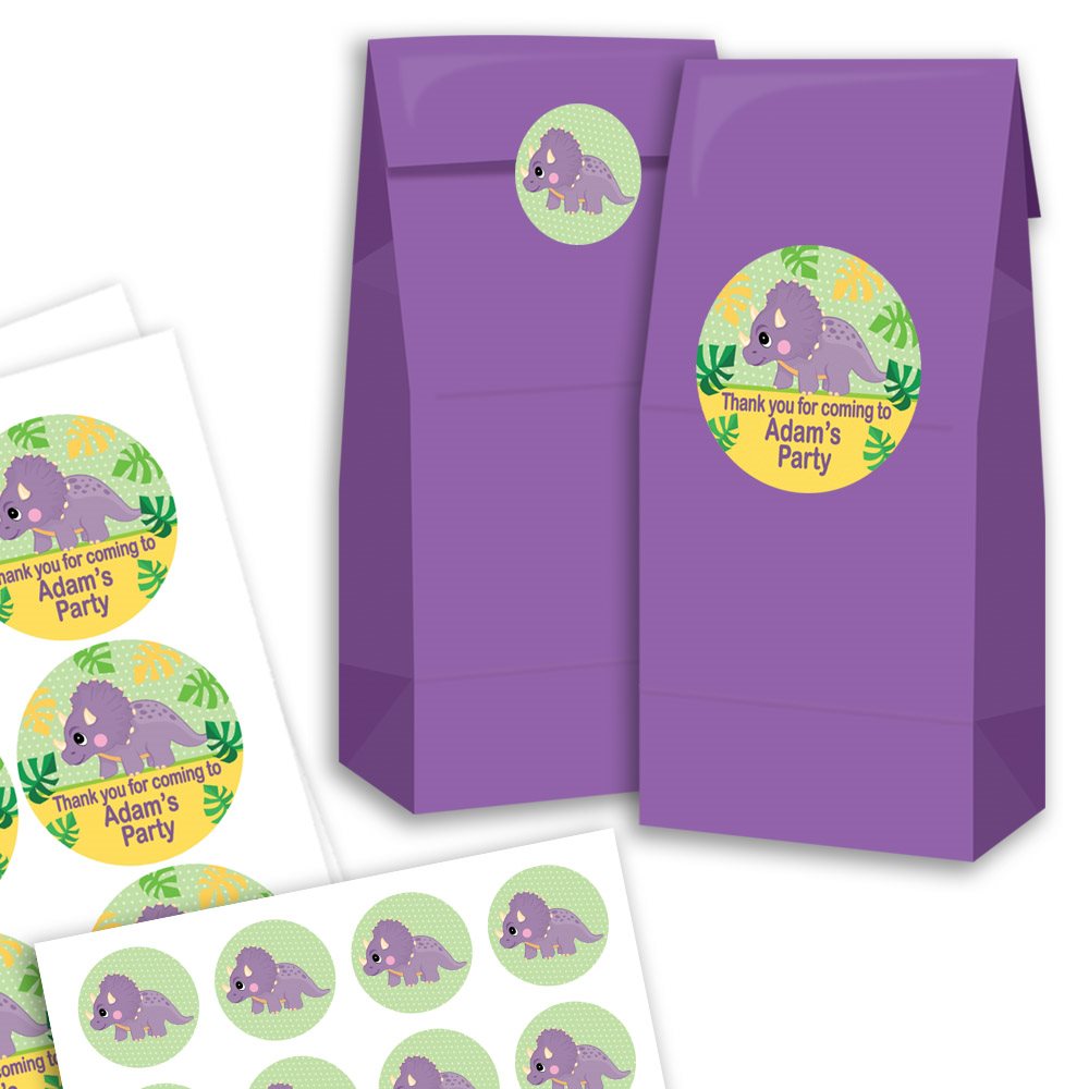 Purple party favour bags with dinosaur-themed stickers on a white background