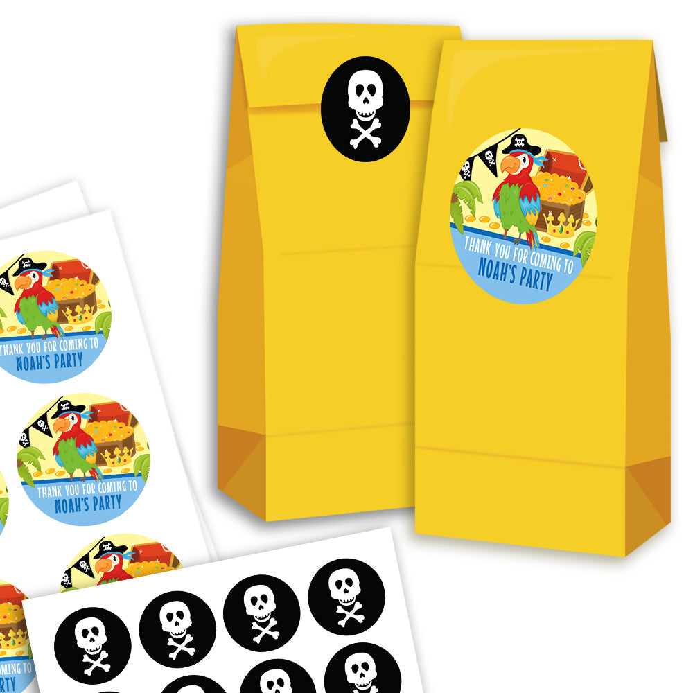 Yellow goodie bags with pirate-themed stickers and labels on a white background