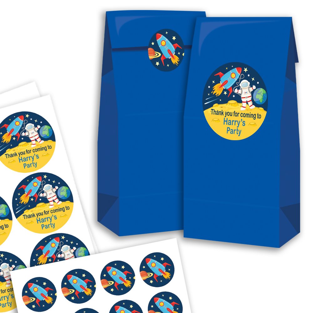 Blue party favour bags with space-themed stickers on a white background