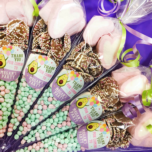 Party favours with 'Thank you for coming to My Party' labels, with a cute avocado design