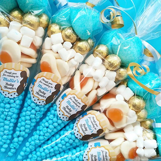 Assorted candy bags with personalized labels on a blue background