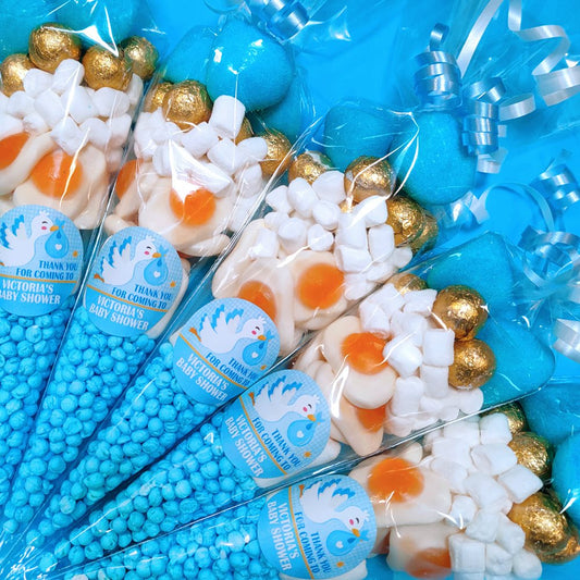 Decorative party favours with blue, gold, and white elements on a blue background