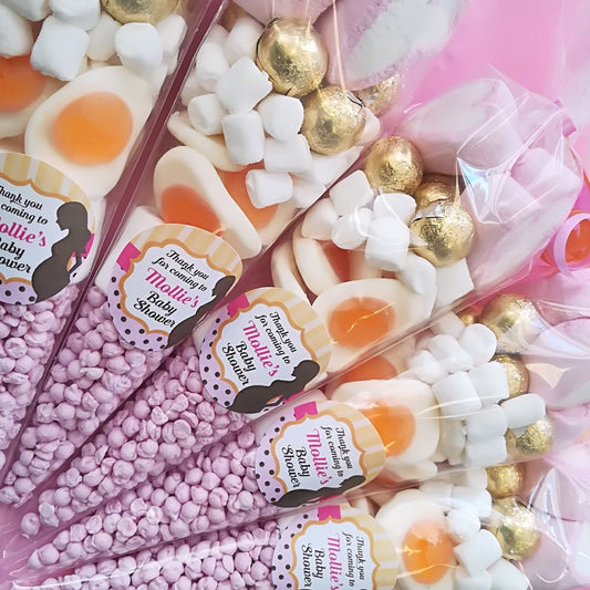 Baby shower candy bouquet with pink and gold elements