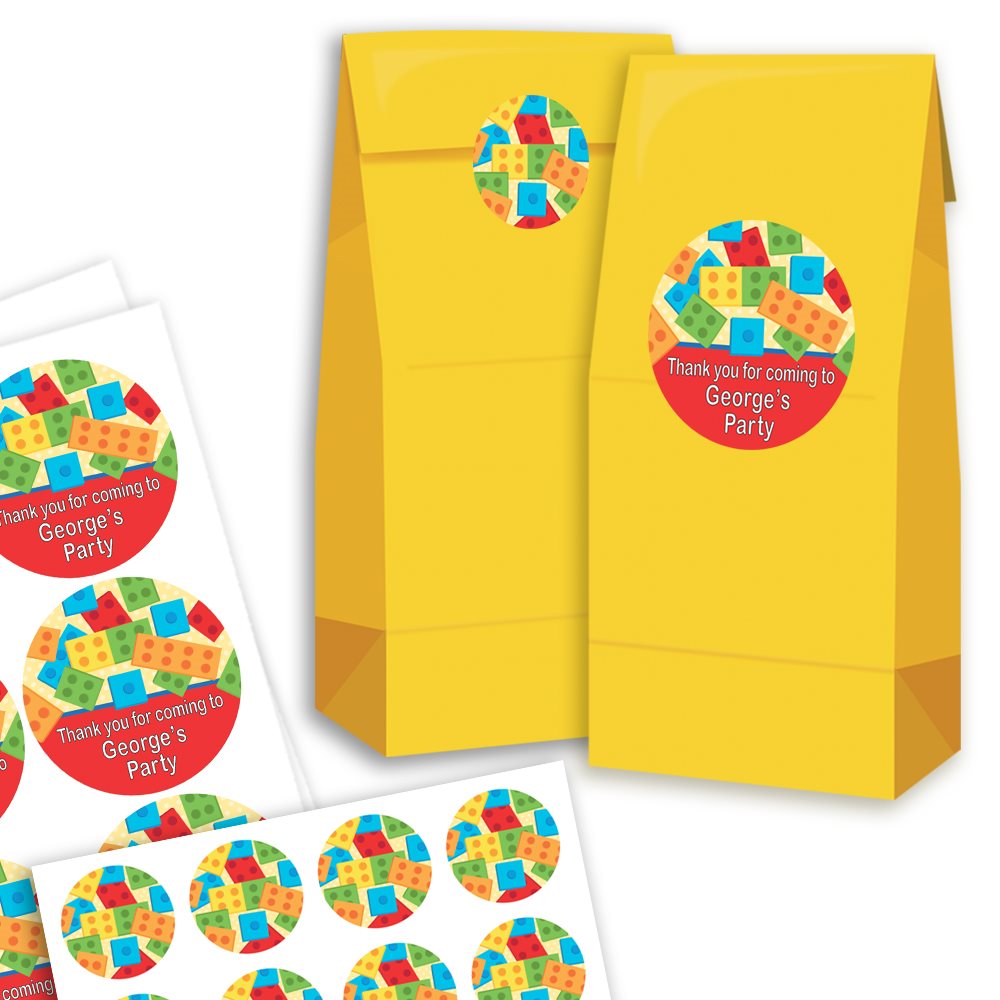 Yellow party favour bags with colourful geometric design labels on a white background