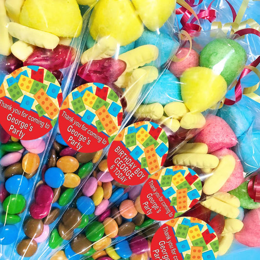Colorful candy bags with personalized labels for a birthday party.