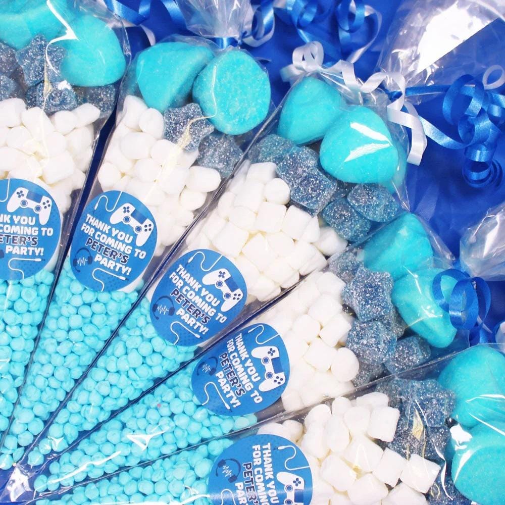 Pre-filled sweet cones with various candies primarily in blue shades, wrapped with personalized PlayStation-themed wrappers.