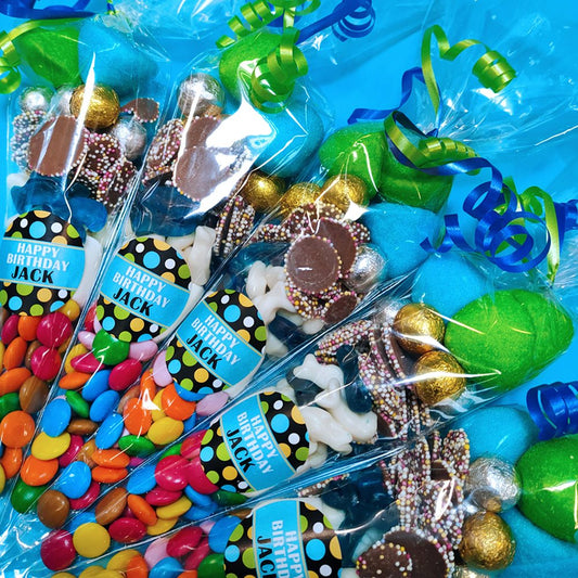 Assorted sweets in cones with 'Happy Birthday' labels party favour