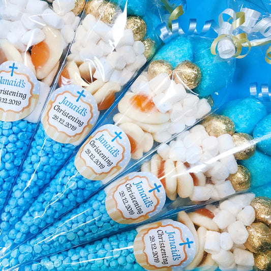 Party favors with personalized labels for a christening event.