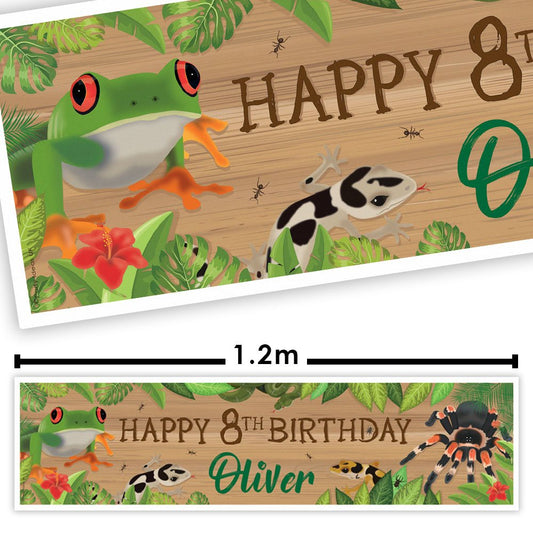 Birthday banner with jungle animals and 'Happy 8th Birthday Oliver' text on a wooden background.