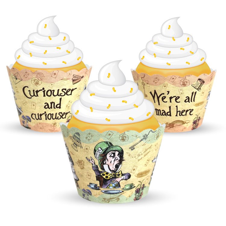 Three cupcakes with decorative wrappers featuring text and graphics on a white background