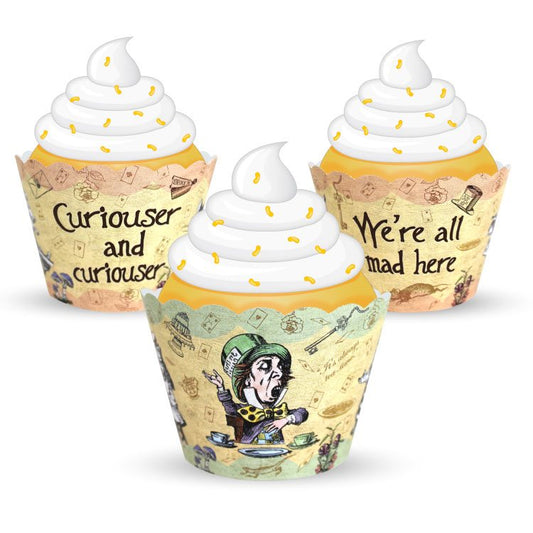Three cupcakes with decorative wrappers featuring text and graphics on a white background