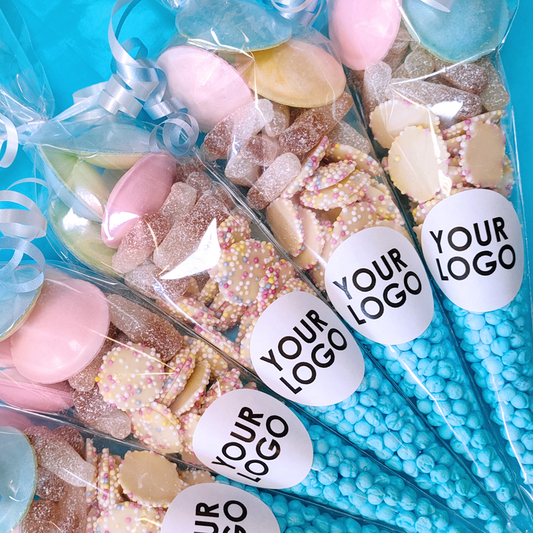 Assorted candy in clear bags with 'Your Logo' labels on a blue background