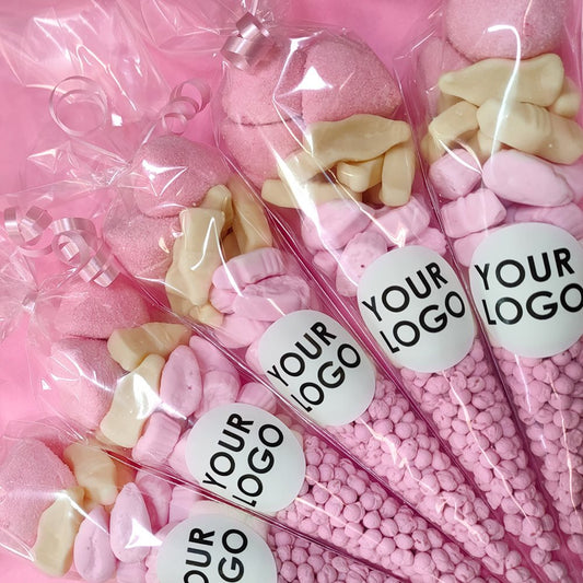 Pink and white candy in clear bags with 'Your Logo' labels on a pink background