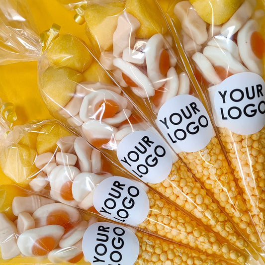 Candy sticks with 'YOUR LOGO' labels in a clear package.