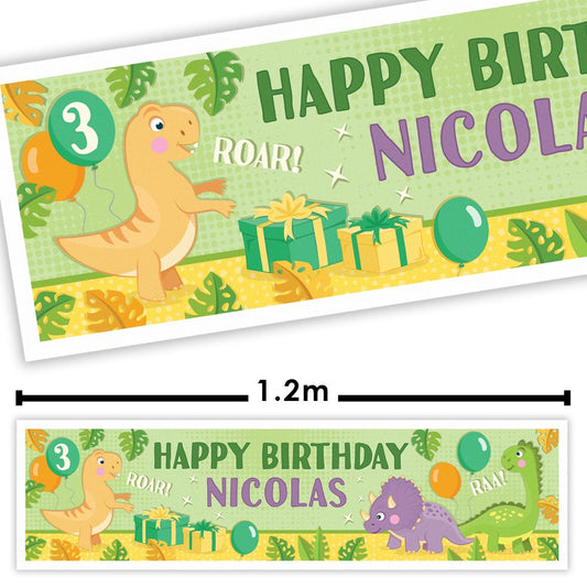 Dinosaur-themed birthday banner with 'Happy Birthday Nicolas' text, measurements, and cartoon dinosaurs.