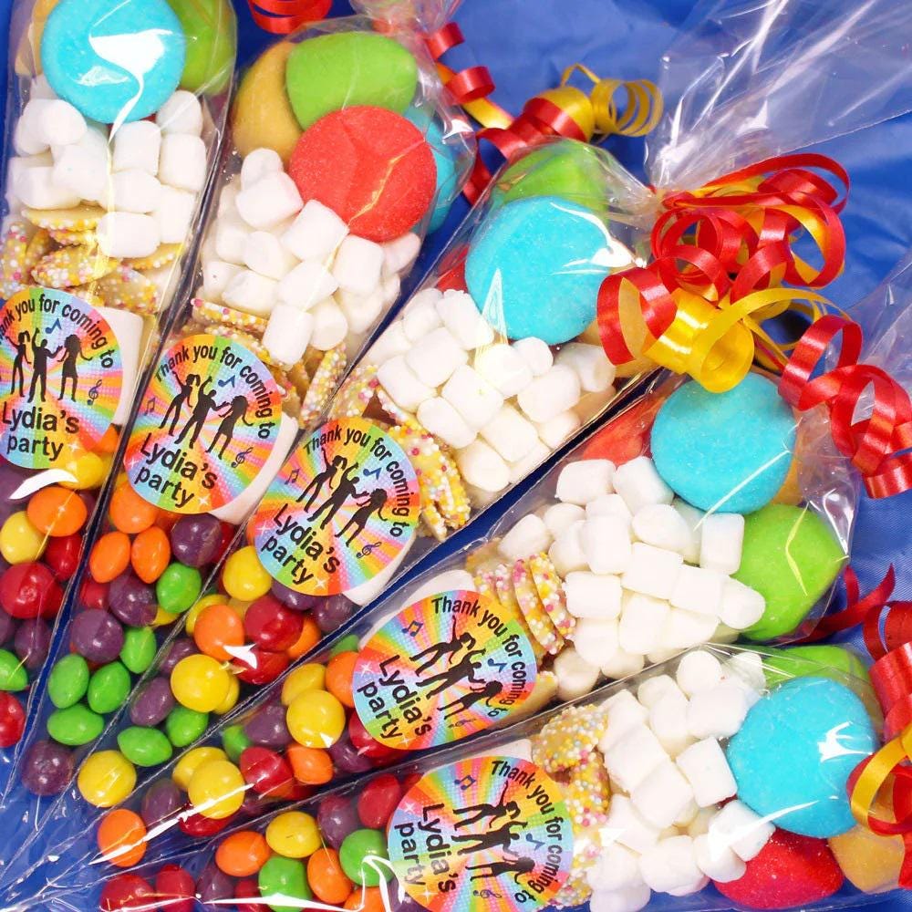 Pre-filled sweet cones with a variety of candies, including SKITTLES, marshmallows, and chocolate jazzies, decorated with disco-themed stickers and party streamers.