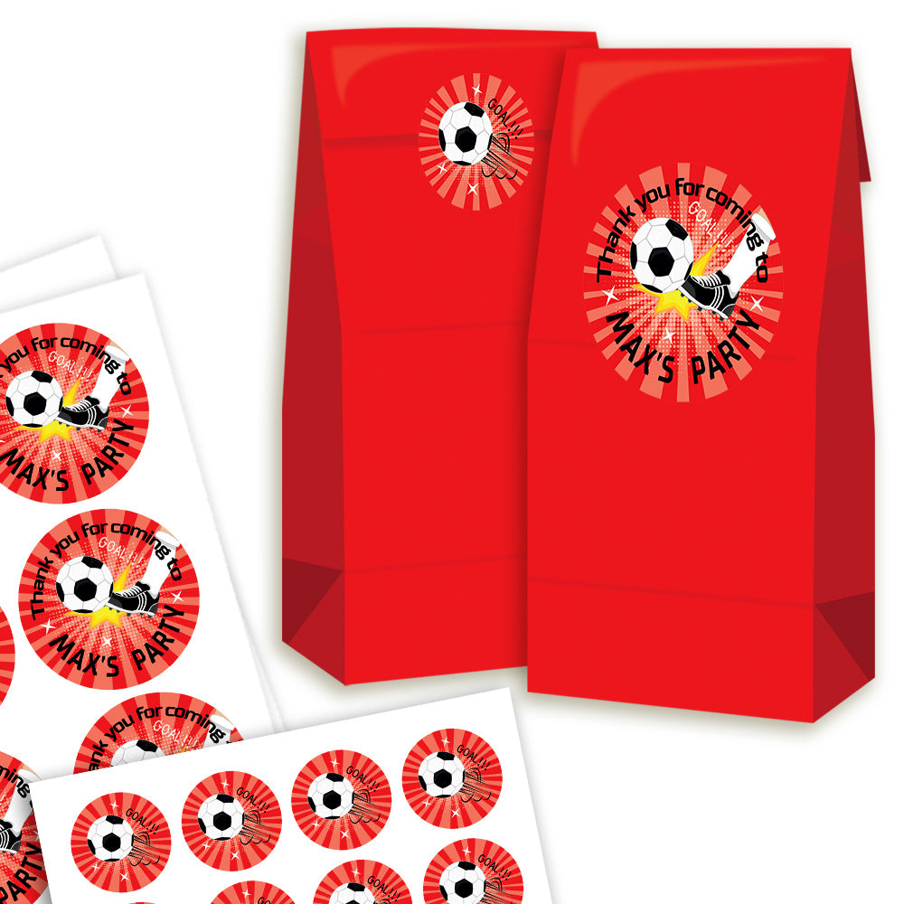 Red party favor bags with soccer-themed stickers on a white background