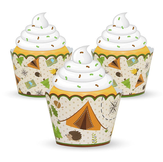 Three cupcakes with whipped cream and camping-themed wrappers on a white background