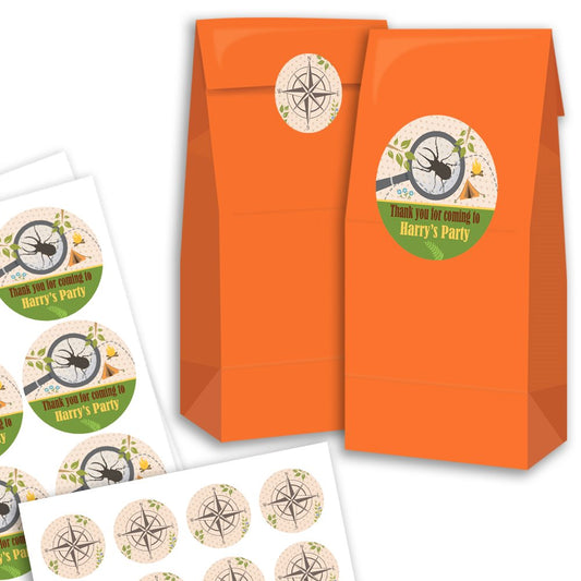 Orange party favour bags with personalised labels on a white background