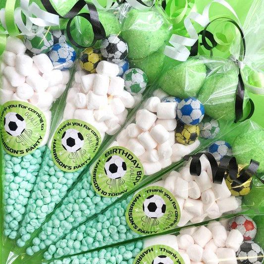 Pre-filled sweet cones with green wrapping and football decorations, containing various sweets