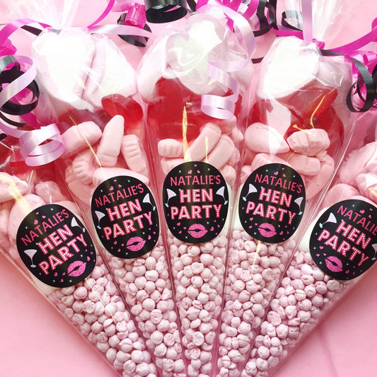 Pink sweet cones with 'Natalie's Hen Party' labels on a pink background