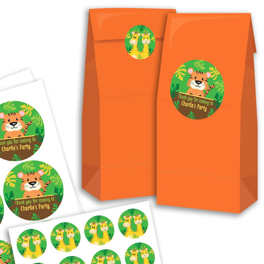 Orange party favour bags with jungle-themed stickers on a white background