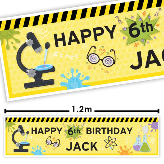 Science-themed birthday banner with 'Happy 6th Birthday Jack' on a yellow background with black and yellow striped border.