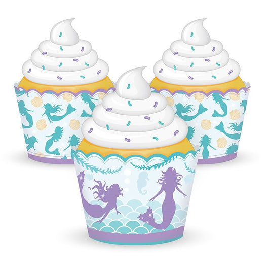 Mermaid-themed cupcake wrappers with white frosting on a white background