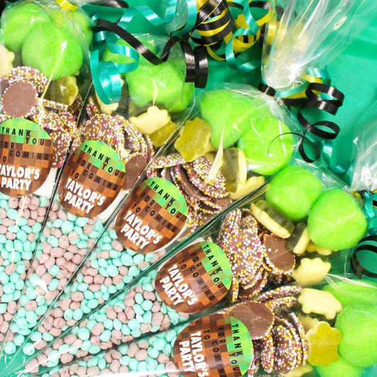 Personalised sweet cones for Minecraft themed parties, showing cones with various candies and custom labels.
