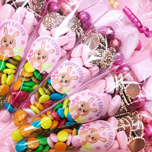 Assorted Easter candy with 'Happy Easter' labels featuring cartoon bunnies.