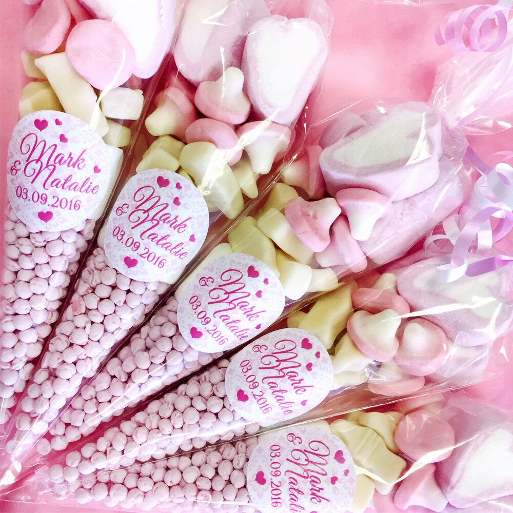 Packaged candy with personalized labels on a pink background