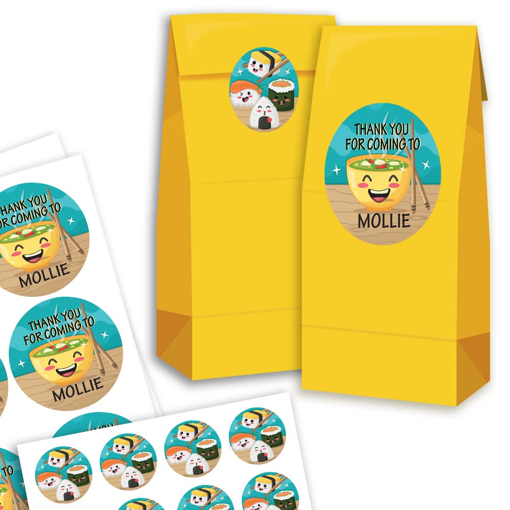 Yellow goodie bags with personalized stickers on a white background