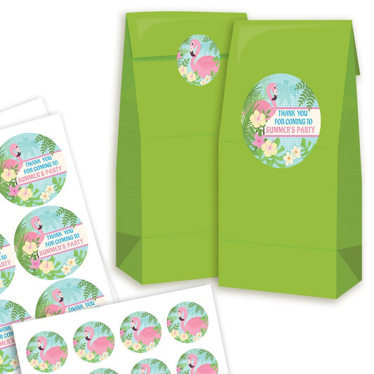 Green party favor bags with flamingo-themed stickers on a white background
