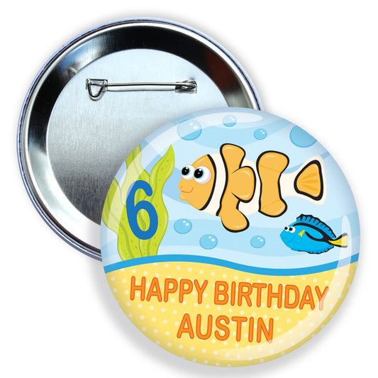Button badge with clownfish design and 'Happy Birthday Austin' text on a white background