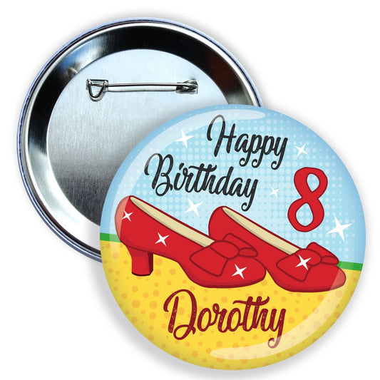 Button badge with red shoes, 'Happy Birthday 8 Dorothy' text on a blue and yellow background