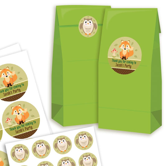 Green party favor bags with fox-themed stickers on a white background