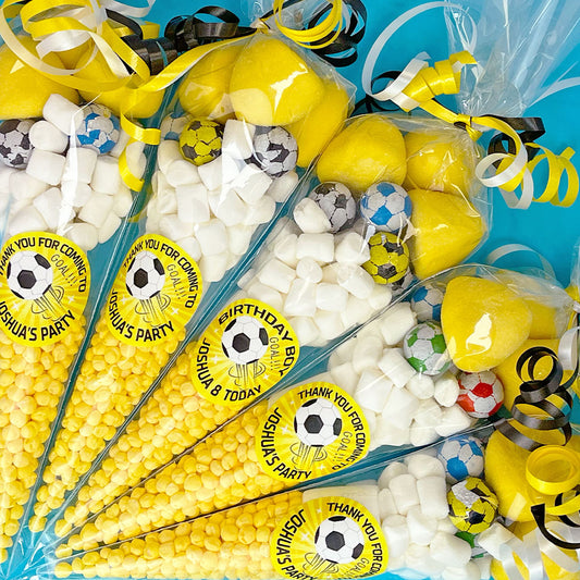 Party favours with football themed decorations and 'Thank you for coming to my birthday party' labels.